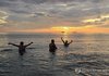 Tourists from abroad play in the water to cool off at Gyeongpo Beach in Gangneung, Gangwon Province, on South Korea's east coast, in the early hours of Aug. 25, 2026, after going through a tropical night, when the thermometer does not dip below 25 C. (Yonhap) (END)