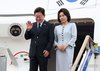 President Lee Jae Myung (L), alongside his wife, Kim Hea Kyung, waves upon arrival at Seoul Air Base in Seongnam, south of Seoul, on Sept. 10, 2026, wrapping up a four-day state visit to France. (Yonhap) (END)