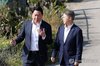 SK Group Chairman Chey Tae-won (L) visits Gwangju Air Base in the southwestern namesake city on Oct. 9, 2026, after the air base was selected as the site for a project to build a new chip cluster. (Yonhap) (END)