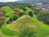 Workers cut grass around a royal tomb from the Silla Dynasty (57 BC-AD 935) in the ancient city of Gyeongju, southeastern South Korea, on Sept. 18, 2026, ahead of Chuseok, the major Korean harvest festival that falls on Sept. 25 this year. Mowing grass around ancestors' tombs is part of Koreans' preparations for the observation of Chuseok. (Yonhap) (END)