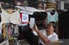 A customer using a Quick Response Code Indonesian Standard (QRIS) digital payment 