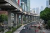 Vehicles pass along Jalan Rasuna Said in Kuningan, Jakarta