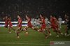 Indonesian national football team players celebrate