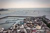 a fishing community protected by a sea wall in the Kampung Bahari Tambaklorok area, Tanjung Mas, Semarang, Central Java