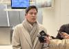 Shinsegae Group Chairman Chung Yong-jin speaks to reporters after arriving at John F. Kennedy International Airport in New York on Jan. 18, 2025. (Yonhap)