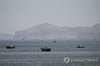 This Reuters file photo shows ships and boats in the Strait of Hormuz in Musandam, Oman, on April 22, 2026. (Yonhap)