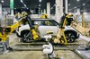 Industrial robotic arms automatically attach door trim to a vehicle at Hyundai Motor Group's Uiwang Research and Development Center in Uiwang, south of Seoul, on Oct. 14, 2026. (PHOTO NOT FOR SALE) (Yonhap)