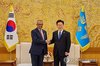 President Lee Jae Myung (R) shakes hands with World Health Organization (WHO) Director-General Tedros Adhanom Ghebreyesus prior to their meeting on Oct. 21, 2026, in this photo provided by Cheong Wa Dae. (PHOTO NOT FOR SALE) (Yonhap)
