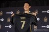 Son Heung-min of Los Angeles Football Club poses with his new shirt with the Major League Soccer team during his introductory press conference at BMO Stadium in Los Angeles on Aug. 6, 2025, in this EPA photo. (Yonhap)