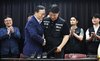 Choi Seung-ho (R, front), head of Samsung Electronics Co's largest labor union, shakes hands with Yeo Myeong-gu (L, front), head of Samsung Electronics Co.'s device solutions division's people team, after signing a tentative agreement in Suwon, south of Seoul, on May 20, 2026. (Pool photo) (Yonhap)
