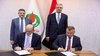 Deputy Prime Minister for Energy Affairs and Minister of Oil Hayan Abdul-Ghani (right-standing), US Chargé d'Affaires Stephen Fagin (left-standing) 