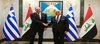 Deputy PM, Foreign Minister, Fuad Hussein (right), his Greek counterpart, Georgios Gerapetritis (left)