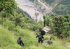 Members of a South Korean government rapid response team travel through Ramche in Rasuwa district, Nepal, on Sept. 2, 2026, to search for the Upper Trishuli-1 (UT-1) hydropower plant site following massive floods that left nine South Koreans unaccounted for. (Yonhap)