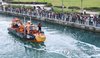 Maritime authorities conduct a rescue operation on Sept. 29, 2026, to guide a shark out of a canal at a waterfront park to the open sea in the southeastern city of Busan. (Yonhap)