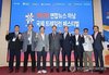Participants, including Hwang Dae-il (4th from L), president and CEO of Yonhap News Agency, pose for a group photo during the launch ceremony for the organizing committee of the 2026 Yonhap Hanam International Trail Running Festival at Korea National Sport University in Seoul on Sept. 15, 2026. (Yonhap)